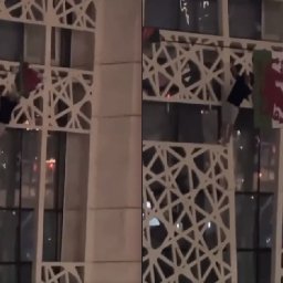 watch-wales-fan-scales-front-of-building-to-rescue-welsh-flag